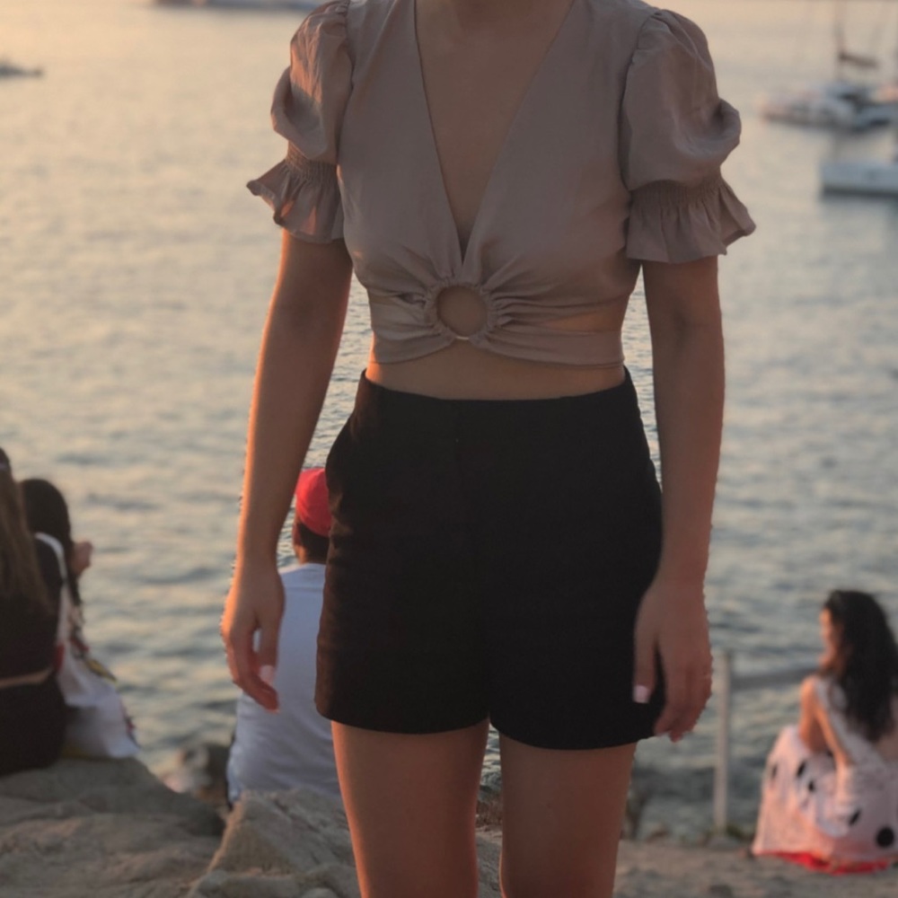 J.O.A. Crop top with ruffle sleeve, ring cut out, and tie back detail